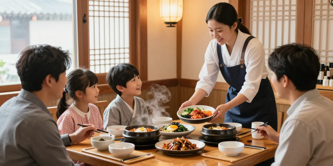 Family enjoying traditional 상봉동 한국관나이트 dishes in a cozy restaurant setting, showcasing vibrant dishes and warm ambiance.